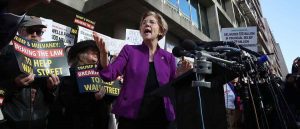 WASHINGTON, DC - NOVEMBER 28: Sen. Elizabeth Warren (D-MA) speaks during a protest in front of the Consumer Financial Protection Bureau (CFPB) headquarters on November 28, 2017 in Washington, DC. Sen. Warren is demanding that Mick Mulvaney step aside and let acting CFPB director Leandra English do her job. President Trump named Office of Management and Budget (OMB) Director Mick Mulvaney to replace outgoing CFPB Director Richard Cordray. (Photo by Mark Wilson/Getty Images)
