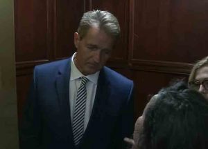 Sexual assault survivors confront Sen. Jeff Flake after announcement about Brett Kavanaugh vote