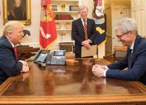 Description: English: President Donald J. Trump and CEO of Apple Tim Cook in the Oval Office at the White House. April 25, 2018. In the background: John Bolton. Date: 25 April 2018. Source: https://www.whitehouse.gov/briefings-statements/photos-of-the-week-042718/ Author: Official White House Photo (Wikipedia)
