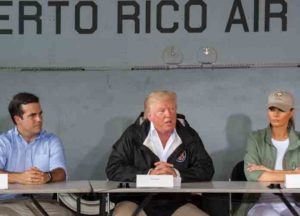 Puerto Rico Gov. Ricardo Roselló, U.S. President Donald Trump and First Lady Melania Trump discuss relief efforts during a cabinet meeting at Muñiz Air National Guard Base, Carolina, Puerto Rico, Oct. 3, 2017. The President visited Puerto Rico following Hurricane Maria and met with local leadership regarding storm response efforts. (U.S. Air National Guard photo by Staff Sgt Michelle Y. Alvarez-Rea)