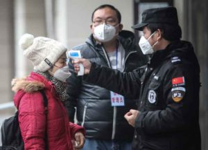 WUHAN, CHINA - JANUARY 22: (CHINA OUT) Security personnel check the temperature of passengers in the Wharf at the Yangtze River on January 22, 2020 in Wuhan, Hubei province, China. A new infectious coronavirus known as "2019-nCoV" was discovered in Wuhan as the number of cases rose to over 400 in mainland China. Health officials stepped up efforts to contain the spread of the pneumonia-like disease which medicals experts confirmed can be passed from human to human. The death toll has reached 17 people as the Wuhan government issued regulations today that residents must wear masks in public places. Cases have been reported in other countries including the United States, Thailand, Japan, Taiwan, and South Korea