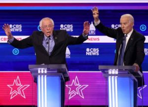 CHARLESTON, SOUTH CAROLINA - FEBRUARY 25: Democratic presidential candidate Sen. Bernie Sanders (I-VT) (L) speaks as former Vice President Joe Biden reacts during the Democratic presidential primary debate at the Charleston Gaillard Center on February 25, 2020 in Charleston, South Carolina. Seven candidates qualified for the debate, hosted by CBS News and Congressional Black Caucus Institute, ahead of South Carolina’s primary in four days. (Image: Getty)