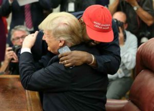 WASHINGTON, DC - OCTOBER 11: U.S. President Donald Trump hugs rapper Kanye West during a meeting in the Oval office of the White House on October 11, 2018 in Washington, DC. (Image: Getty)