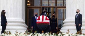 WASHINGTON, DC - SEPTEMBER 24: U.S. President Donald Trump and first lady Melania Trump pay their respects to Associate Justice Ruth Bader Ginsburg's flag-draped casket on the Lincoln catafalque on the west front of the U.S. Supreme Court September 24, 2020 in Washington, DC. A pioneering lawyer and according the Chief Justice John Roberts 'a jurist of historic stature,' Ginsburg died September 18 at the age of 87 after a long battle against cancer.
