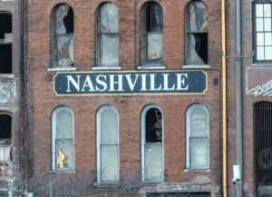NASHVILLE, TENNESSEE - DECEMBER 25: Police close off an area damaged by an explosion on Christmas morning on December 25, 2020 in Nashville, Tennessee. A Hazardous Devices Unit was en route to check on a recreational vehicle which then exploded, extensively damaging some nearby buildings. According to reports, the police believe the explosion to be intentional, with at least 3 injured and human remains found in the vicinity of the explosion.