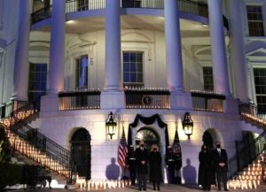 WASHINGTON, DC - FEBRUARY 22: (L-R) U.S. President Joe Biden, first lady Jill Biden, Vice President Kamala Harris and husband Doug Emhoff participate in a moment of silence at sundown in the South Portico of the White House February 22, 2021 in Washington, DC. The four held a candlelight ceremony to mark the more than 500,000 lives lost in the U.S. to COVID-19 since the pandemic hit. (Photo by Alex Wong/Getty Images)