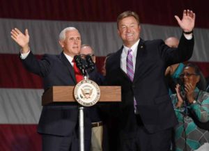 LAS VEGAS, NV - SEPTEMBER 07: U.S. Vice President Mike Pence (L) waves as he is introduced by U.S. Sen. Dean Heller (R-NV) at Nellis Air Force Base on September 7, 2018 in Las Vegas, Nevada. Pence is visiting Las Vegas to support Heller's re-election and Nevada Attorney General and Republican gubernatorial candidate Adam Laxalt's campaigns. (Photo by Ethan Miller/Getty Images)