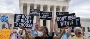 Pro-choice activists hold signs outside the U.S. Supreme Court in Washington, D.C., U.S., on Monday, Oct. 4, 2021. The court's conservative wing to offers a menu of opportunities exploit its 6-3 majority, and give Republicans the type of payoff they envisioned when they pushed through her Senate confirmation just before the 2020 election. Photographer: Stefani Reynolds/Bloomberg via Getty Images