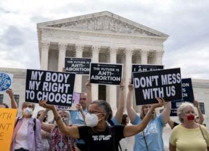 Pro-choice activists hold signs outside the U.S. Supreme Court in Washington, D.C., U.S., on Monday, Oct. 4, 2021. The court's conservative wing to offers a menu of opportunities exploit its 6-3 majority, and give Republicans the type of payoff they envisioned when they pushed through her Senate confirmation just before the 2020 election. Photographer: Stefani Reynolds/Bloomberg via Getty Images