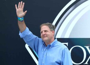 LOUDON, NEW HAMPSHIRE - AUGUST 02: New Hampshire Governor Chris Sununu waves from the stage prior to the NASCAR Cup Series Foxwoods Resort Casino 301 at New Hampshire Motor Speedway on August 02, 2020 in Loudon, New Hampshire. (Photo by Maddie Meyer/Getty Images)