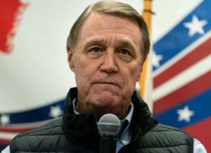 DALTON, GA - FEBRUARY 01: Former U.S. senator and Republican gubernatorial candidate David Perdue speaks at a campaign event on February 1, 2022 in Dalton, Georgia. Purdue kicked off his campaign, in which he will first face incumbent Republican Gov. Brian Kemp in the May primary, the winner of which will face likely Democratic candidate Stacey Abrams, speaking on teacher pay and law enforcement. The Perdue campaign aired a video endorsement by former President Donald Trump at the event. (Photo by Elijah Nouvelage/Getty Images)