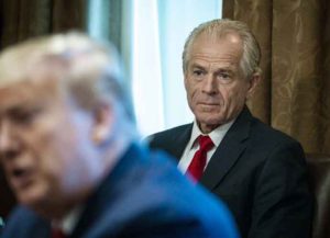 Peter Navarro, director of the National Trade Council, right, listens as U.S. President Donald Trump speaks during a meeting with executives of supply chain distributors in the Cabinet Room of the White House in Washington, D.C., U.S., on Sunday, March 29, 2020. Trump said his administration expects the peak of deaths in the U.S. coronavirus outbreak to be reached in about two weeks, and that he would extend current social distancing guidelines for Americans until April 30. Photographer: Pete Marovich/The New York Times/Bloomberg via Getty Images