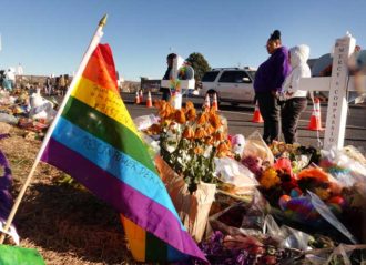 COLORADO SPRINGS, CO - NOVEMBER 22: Mourners at a memorial outside of Club Q on November 22, 2022 in Colorado Springs, Colorado. A gunman opened fire inside the LGBTQ+ club on November 19th, killing 5 and injuring 25 others. (Photo by Chet Strange/Getty Images)