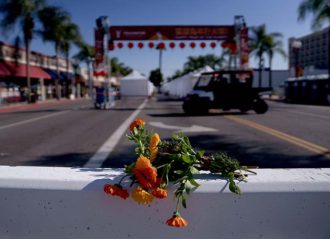 MONTEREY PARK, CA - JANUARY 22: Flowers are placed near the scene of a deadly mass shooting on January 22, 2023 in Monterey Park, California. 10 people were killed and 10 more were injured at a dance studio in Monterey Park near a Lunar New Year celebration on Saturday night. (Photo by Eric Thayer/Getty Images)