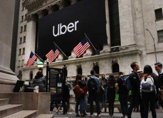 NEW YORK, NEW YORK - MAY 10: The Uber banner hangs outside of the New York Stock Exchange (NYSE) before the Opening Bell at the NYSE as the ride-hailing company Uber makes its highly anticipated initial public offering (IPO) on May 10, 2019 in New York City. Uber will start trading on the New York Stock Exchange after raising $8.1 billion in the biggest U.S. IPO in five years.Thousands of Uber and other app based drivers protested around the country on Wednesday to demand better pay and working conditions including sick leave, over time and a minimum wage. (Photo by Spencer Platt/Getty Images)