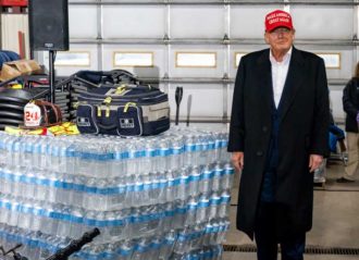 EAST PALESTINE, OH - FEBRUARY 22: Former President Donald Trump stands next to a pallet of water before delivering remarks at the East Palestine Fire Department station on February 22, 2023 in East Palestine, Ohio. On February 3rd, a Norfolk Southern Railways train carrying toxic chemicals derailed causing an environmental disaster. Thousands of residents were ordered to evacuate after the area was placed under a state of emergency and temporary evacuation orders. (Photo by Michael Swensen/Getty Images)