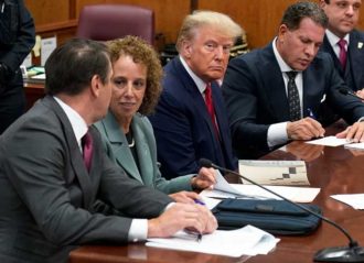NEW YORK, NEW YORK - APRIL 04: Former U.S. President Donald Trump sits at the defense table with his defense team in a Manhattan court during his arraignment on April 4, 2023, in New York City. Trump was arraigned during his first court appearance today following an indictment by a grand jury that heard evidence about money paid to adult film star Stormy Daniels before the 2016 presidential election. With the indictment, Trump becomes the first former U.S. president in history to be charged with a criminal offense. (Photo by Seth Wenig-Pool/Getty Images)