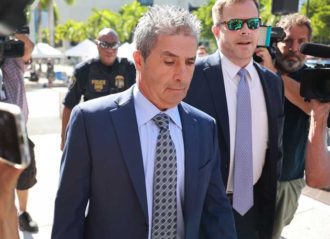 MIAMI, FLORIDA - JULY 31: Carlos De Oliveira (L), a property manager for former U.S. President Donald Trump's Mar-a-Lago estate, arrives with his lawyer John Irving at the James Lawrence King Federal Justice Building on July 31, 2023 in Miami, Florida. Special counsel Jack Smith announced three new felony charges against Trump, including claims that he asked De Oliveira to delete security camera footage of his Mar-a-Lago home that was being sought by investigators probing his handling of classified documents. (Photo by Joe Raedle/Getty Images)