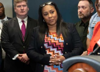 ATLANTA, GA - MAY 3: Fulton County District Attorney Fani Willis (C) attends a press conference at the Atlanta Police headquarters following a shooting at Northside Hospital medical facility on May 3, 2023 in Atlanta, Georgia. Police say one person was killed and four others injured in the shooting and the suspect, Deion Patterson, has been captured. Photo by Megan Varner/Getty Images)