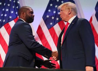 PHILADELPHIA, PENNSYLVANIA - JUNE 30: Rep. Byron Donalds (R-FL) shakes hands with former U.S. President Donald Trump during the Moms for Liberty Joyful Warriors national summit at the Philadelphia Marriott Downtown on June 30, 2023 in Philadelphia, Pennsylvania. The self-labeled "parental rights" summit is bringing school board hopefuls from across the country where attendees will receive training and hear from Republican presidential candidates which include former U.S. President Donald Trump, Florida Gov. Ron DeSantis and former South Carolina Gov. Nikki Haley. The summit, which is being held in an overwhelmingly Democratic Philadelphia, has drawn protestors since the event was announced due to their pushing of book bans accusing schools of ideological overreach, including teaching about race, gender, and sexuality. (Photo by Michael M. Santiago/Getty Images)