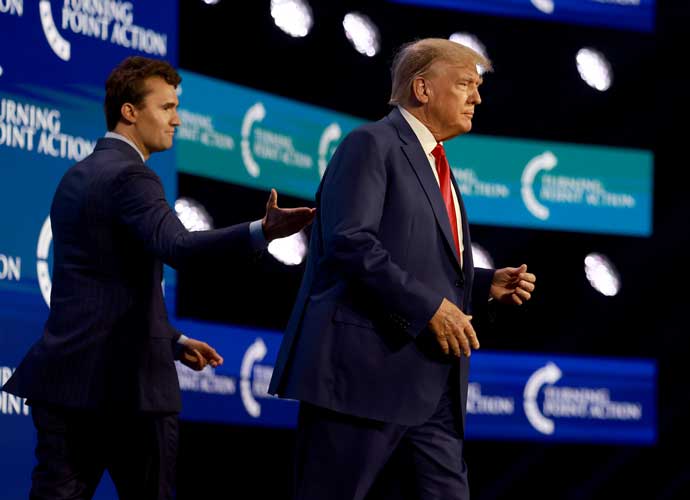 WEST PALM BEACH, FLORIDA - JULY 15: Former US President Donald Trump walks on stage after being introduced by Charlie Kirk (L) at the Turning Point Action conference as he continues his 2024 presidential campaign on July 15, 2023 in West Palm Beach, Florida. Trump spoke at the event held in the Palm Beach County Convention Center. (Photo by Joe Raedle/Getty Images)