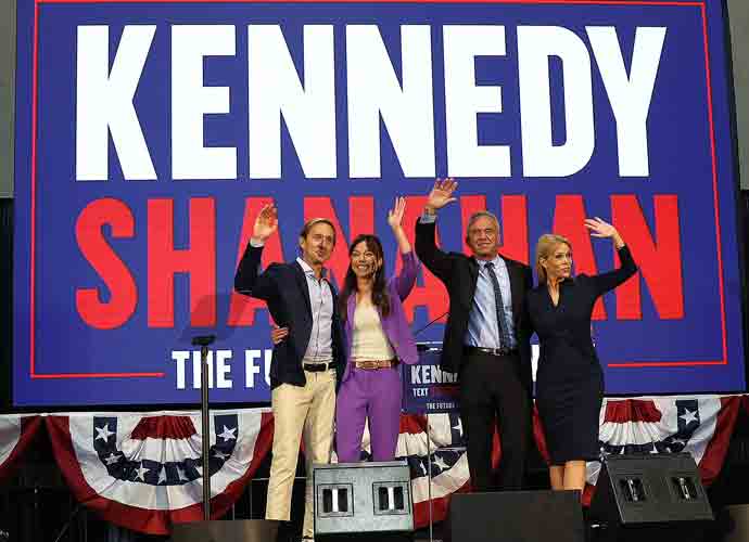 OAKLAND, CALIFORNIA - MARCH 25: (L-R) Jacob Strumwasser, independent Vice Presidential candidate, independent presidential candidate Robert F. Kennedy Jr. and his wife Cheryl Hines greet supporters during a campaign event to announce his pick for a running mate at the Henry J. Kaiser Event Center on March 26, 2024 in Oakland, California. Independent presidential candidate Robert F. Kennedy Jr. announced Silicon Valley attorney Nicole Shanahan as his running mate. (Photo by Justin Sullivan/Getty Images)