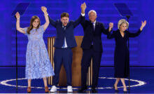 CHICAGO, ILLINOIS - AUGUST 21: Democratic vice presidential nominee Minnesota Gov. Tim Walz celebrates with his daughter Hope Walz (L), son Gus Walz (2nd-L) and wife Gwen Walz (R) after accepting the Democratic vice presidential nomination on stage during the third day of the Democratic National Convention at the United Center on August 21, 2024 in Chicago, Illinois. Delegates, politicians, and Democratic Party supporters are in Chicago for the convention, concluding with current Vice President Kamala Harris accepting her party's presidential nomination. The DNC takes place from August 19-22. (Photo by Chip Somodevilla/Getty Images)