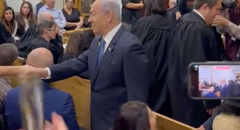 VIDEO: Israeli Prime Minister Netanyahu Greets Gallery In Packed Courtroom Ahead Of Taking Stand In Corruption Case