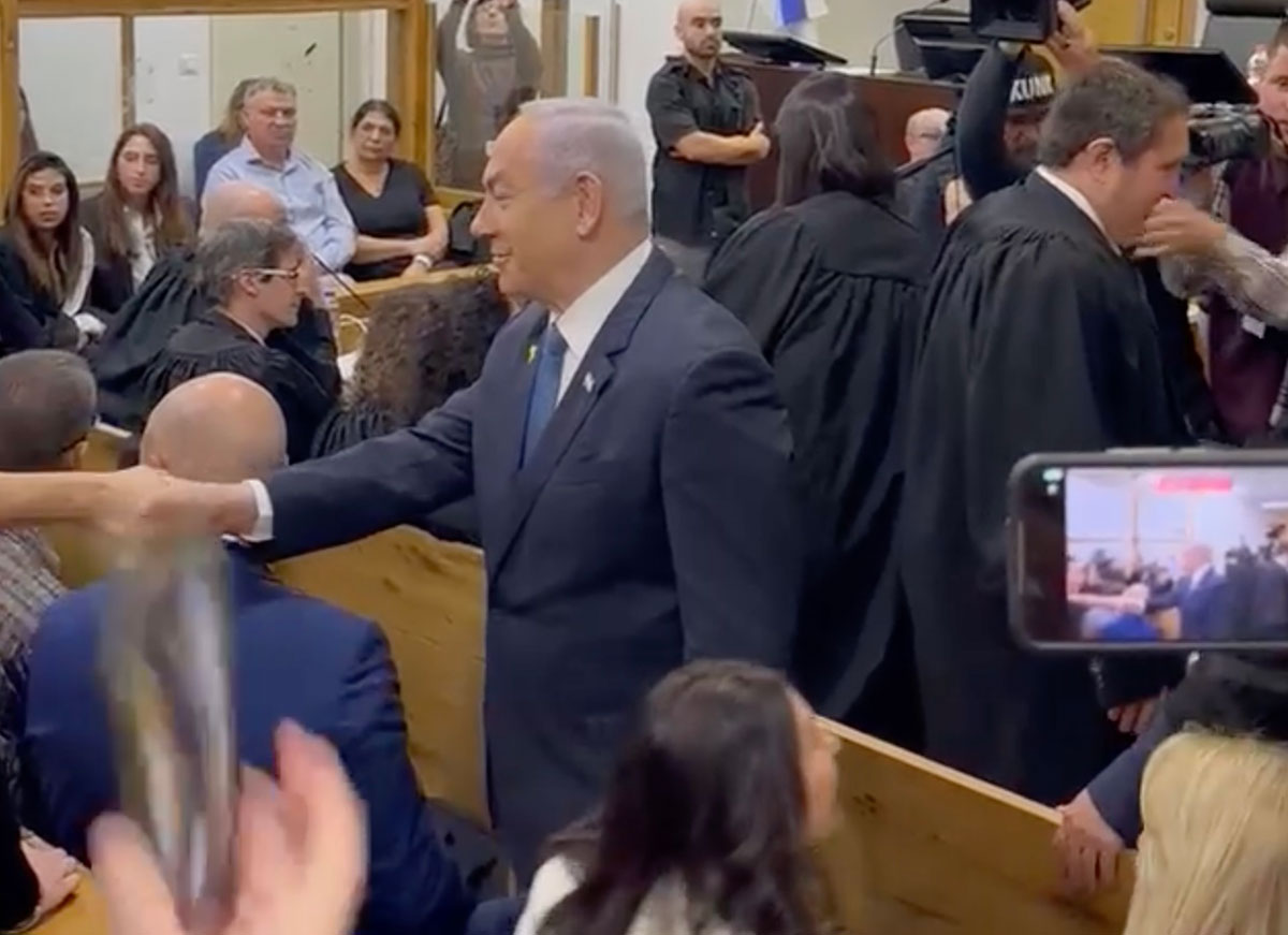 VIDEO: Israeli Prime Minister Netanyahu Greets Gallery In Packed Courtroom Ahead Of Taking Stand In Corruption Case