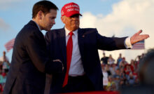 MIAMI, FLORIDA - NOVEMBER 06: Former U.S. President Donald Trump invites Sen. Marco Rubio (R-FL) to speak at the microphone during a rally at the Miami-Dade County Fair and Exposition on November 6, 2022 in Miami, Florida. Rubio faces U.S. Rep. Val Demings (D-FL) in his reelection bid in Tuesday's general election. (Photo by Joe Raedle/Getty Images)