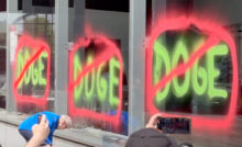 Climate activists spray paint NYC Tesla showroom on Earth Day (Credit: Extinction Rebellion NYC via Storyful)