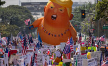 LOS ANGELES, CALIFORNIA - JUNE 14: People march during a "No Kings" movement protest in the one-square mile area where daily protests have been occurring in response to a series of federal immigration raids on June 14, 2025 in Los Angeles, California. Hundreds of marches and protests against the Trump administration are happening across the United States in opposition to Trump policies on the same day as President Trump's 79th birthday and a military parade on the 250th anniversary of the U.S. Army in Washington, DC. (Photo by David McNew/Getty Images)